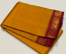 Sarasangi- Gorgeous Mustard with Arakku shot Pink Handwoven Pure Jari Korvai Kanjivaram Silk with Orukunjam Borders Rich Pallu and contrast woven blouse