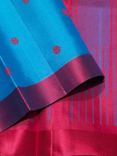 Nayaki- Beautiful Ananda Blue with Red Handwoven Pure Zariless Kanjivaram Silk with lovely banarasi pet matte finish borders with silk thread buttas rich pallu and contrast red blouse
