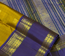 Sahana- Gorgeous Bronze Gold with Violetish Blue Handwoven Pure Jari Kanjivaram Silk with buttas woven body with doublepet borders with gorgeous meenakari woven pallu and contrast woven blouse