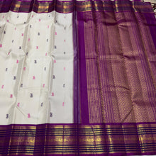 Vaibhogam- Gorgeous Offwhite with Purple Handwoven Pure Zari Korvai Kanjivaram Silk with Pattu Buttas woven body with rich varisaipet borders with beautiful pallu and contrast woven purple blouse