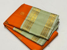Vaibhogam-Gorgeous Orange with Elaichi Green Handwoven Pure Jari Korvai Kanjivaram Silk with beautiful buttas woven body with rich rudrakshas and jari lines striped borders gorgeous pallu and contrast woven blouse