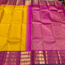 Vaibhogam- Gorgeous Yellow with Rani Pink Handwoven Pure 2g Jari Korvai with Buttas Kanjivaram Silk with varisaipet borders with green selvedges and rich woven pallu and contrast woven blouse