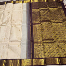 Sarasangi-Gorgeous Offwhite with Coffee Brown Handwoven Pure Korvai Kanjivaram Silk Saree with rich beautiful yazhis and annapakshis woven borders rich pallu and contrast woven blouse