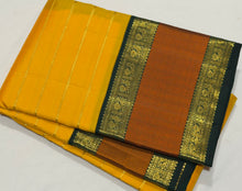 Vaibhogam- Stunning Yellow with Bottle Green Handwoven Pure2g Jari Korvai Kanjivaram Silk with Jari Veldhari woven body with rich silk threads and Jari woven beautiful borders gorgeous pallu and contrast woven blouse