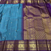 Sahana- Beautiful Teal Blue with Aubergine Purple Handwoven Pure 2g Jari Kanjivaram Silk with beautiful buttas woven body with rich elephants woven borders gorgeous pallu and contrast woven blouse