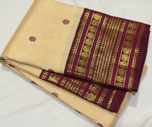 Vaibhogam- Gorgeous Offwhite with Maroonish Brown Handwoven Pure 2g jari Korvai with Buttas Kanjivaram Silk with beautiful thread kamalam buttas woven body with rich varisaipet small elephants and neli veldhari borders rich pallu and contrast woven blouse