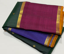 Sahana- Stunning Bottle Green with Ganga Jamuna Borders with buttas with contrast kanakambaram Orange Pallu and blouse in a beautiful Handwoven Pure 2g Jari Kanjivaram Silk Beauty