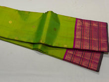 Vaibhogam- Stunning Parrot Green with Fuchsia Pink Handwoven Pure Jari Korvai Kanjivaram Silk with beautiful buttas woven body with rich varisaipet borders beautiful pallu and contrast woven blouse with bottle green selvedges