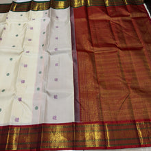 Vaibhogam-Stunning  Offwhite with Ganga Jamuna borders with gorgeous pattu buttas woven body with deep emerald green and burnt orange shade borders beautifully woven rich pallu and contrast woven blouse