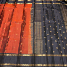 Sahana- Stunning Rust with Black Buttas Handwoven Pure Kanjivaram Silk with beautiful buttas woven body with doublepet borders rich buttas woven pallu and contrast woven blouse