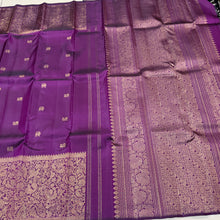 Vaibhogam- Stunning Deep Purple with Gold Handwoven Pure 2g Jari Kanjivaram Silk with beautiful yazhi and mayil buttas woven body with rich Vanasingaram borders on either sides with rich pallu and self colored blouse