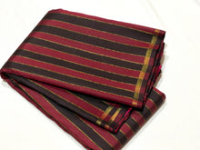 Saranga- Gorgeous Handwoven Pure Kanjivaram Silk in a beautiful Maroon and Black with Zari Striped body with small borders rich pallu and contrast woven blouse