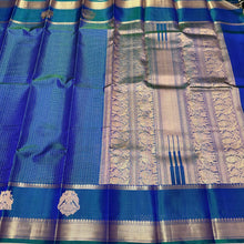Sahana- Beautiful Peacock Blue with Gold and Green selvedges Handwoven Pure Jari Kanjivaram Silk with beautiful yazhis and gandaberunds woven both side borders kottadi jari checks woven body rich pallu and self colored blouse