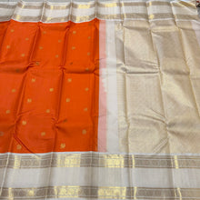 Vaibhogam-Gorgeous Orange with Offwhite Handwoven Pure Jari Korvai with Mayil Chakram Buttas woven body beautiful rettaipet with zari oosi striped borders rich pallu and contrast woven blouse. A stunner for this wedding season!