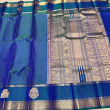 Sahana- Beautiful Peacock Blue with Gold and Green selvedges Handwoven Pure Jari Kanjivaram Silk with beautiful yazhis and gandaberunds woven both side borders kottadi jari checks woven body rich pallu and self colored blouse