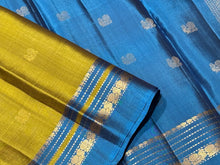 Sahana-Gorgeous Dual tone Sampanga mustard tinted green with teal blue buttas handwoven Pure Kanjivaram with small varisai borders rich buttas woven pallu and contrast woven blouse