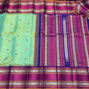 Pista Green with Navy Blue Buttas Korvai Handwoven Pure Zariless Kanjivaram Silk Saree Beauty with Long Borders