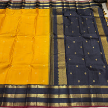 Vaibhogam- Stunning Yellow with Black Handwoven Pure 2g Jari Korvai with Buttas Kanjivaram Silk with beautiful triplepet borders with maroonish red selvedges rich pallu and a beautiful contrast black blouse