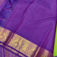 Sarasangi- Gorgeous Parrot Green with Violetish Purple Handwoven Pure 2g Jari Korvai Kanjivaram Silk with beautiful double peacocks woven borders rich pallu and contrast woven blouse