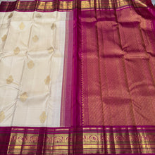 Vaibhogam-Mindblowing Offwhite with Pink Handwoven Pure Jari Korvai Kanjivaram Silk Saree with rich Buttas Woven Body with intricate Meenakari Work Borders Gorgeous Pallu and Contrast woven blouse