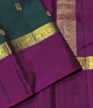 Sahana- Stunning Bottle Green with Dark Magenta Mayil Chakram Buttas Handwoven Pure 2g Jari Kanjivaram Silk with Spaced borders rich pallu and contrast woven blouse
