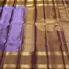 Sahana- Gorgeous Lavendar with Bronze Gold Combo in a Handwoven Pure Jari Kanjivaram Silk with elephants annapakshis and deer motits woven all over the body with beautiful rudrakshas woven rettapet borders with gorgeous pallu and contrast woven blouse