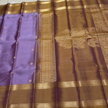 Sahana- Gorgeous Lavendar with Bronze Gold Combo in a Handwoven Pure Jari Kanjivaram Silk with elephants annapakshis and deer motits woven all over the body with beautiful rudrakshas woven rettapet borders with gorgeous pallu and contrast woven blouse