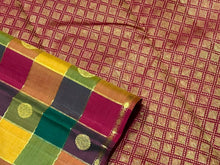 Saranga- Super Gorgeous Handwoven Pure Kanjivaram Silk Saree in a Beautiful Palum Pazhamum Checks with traditional colors with mango and chakram buttas woven in the body with neli veldhari jari lined checks rich woven pallu and contrast arakku red blouse