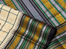 Saraswati- Offwhite with Deep Blackish Brown Handwoven Pure Premium Zariless Korvai Kanjivaram Silk with beautiful neli veldhari checked body with mango and chakram buttas with rich varisaipet borders rich pallu and contrast woven blouse