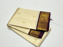 Sarasangi-Gorgeous Offwhite with Coffee Brown Handwoven Pure Korvai Kanjivaram Silk Saree with rich beautiful yazhis and annapakshis woven borders rich pallu and contrast woven blouse