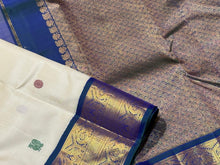 Stunning Handwoven Pure Jari Kai Korvai Kanjivaram Silk Saree in Offwhite body with Sapphire Blue combination with rich pattu buttas woven body gorgeous borders rich pallu and contrast woven blouse