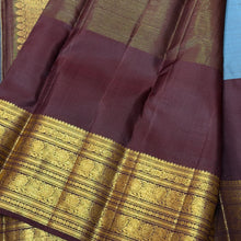 Vaibhogam-Beautiful Pastel Blue with Dark Brown Handwoven Pure Jari Korvai Kanjivaram Silk with Vairaoosi with buttas woven middle body with coffee brown buttas woven lower body and rich broad borders gorgeous pallu and contrast woven blouse