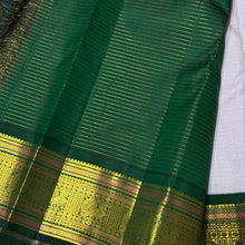 Vaibhogam- Gorgeous Lavendar with Bottle Green Handwoven Pure Jari Kanjivaram Silk with Jari Oosi Kattam Woven Body with Buttas rich Meenakari Work Woven Borders Beautiful Kalashetra Rettaikili buttas woven pallu and contrast woven blouse