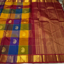 Vaibhogam- Stunning Palum Pazhamum checks in a unique and unusual palette of colors with paisley buttas woven body with rich bawanchi borders gorgeous and beautifully woven pallu in arakku with contrast checked arakku blouse