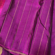 Saranga-Gorgeous Mubbakam Style Handwoven PureKanjivaram Silk in a beautiful black and deep magenta combination with middle portion in black and eithersides in deep magenta color with muthukattam striped body with paisleys woven with rich pallu and blouse