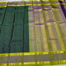 Sarasangi-Gorgeous Handwoven Pure Korvai Kanjivaram Silk in a beautiful Bottle Green with Dual tone Violetish Green and Parrot Green Rettapet borders with beautiful pallu and contrast woven blouse
