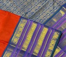 Vaibhogam- Stunning Burnt Orange Red with Peacock Blue Handwoven Pure Jari Korvai Kanjivaram Silk with Plain body rich varisaipet borders beautiful peacock blue pallu and contrast woven blouse
