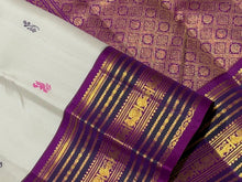 Vaibhogam- Gorgeous Offwhite with Purple Handwoven Pure Zari Korvai Kanjivaram Silk with Pattu Buttas woven body with rich varisaipet borders with beautiful pallu and contrast woven purple blouse