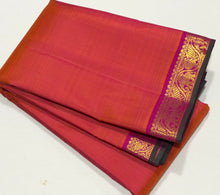 Nayaki- Gorgeous Orange Pink with Pink Handwoven Pure Jari Kanjivaram Silk with beautiful small borders with green selvedges rich pallu and contrast woven blouse