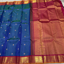 Vaibhogam- Gorgeous Peacock Blue with Deep Arakku Red  Handwoven Pure 2g Jari Korvai with Buttas Kanjivaram Silk with rich borders gorgeous pallu and contrast woven blouse