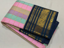 Vaibhogam- Beautiful Palum Pazhamum Jari Checks in pastel palette of colors in Handwoven Pure Zari Korvai Kanjivaram Silk with rich jari checks body with Deep sapphire blue borders intricate and beautifully woven with rich pallu and contrast blouse