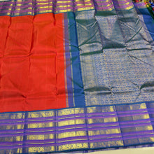 Vaibhogam- Stunning Burnt Orange Red with Peacock Blue Handwoven Pure Jari Korvai Kanjivaram Silk with Plain body rich varisaipet borders beautiful peacock blue pallu and contrast woven blouse