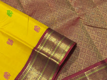 Vaibhogam -Stunning Yellow with Burgundy and BottleGreen Handwoven Pure Jari Korvai Kanjivaram Silk with silk buttas woven beautiful body with rich Gandaberundas woven ganga jamuna borders on both sides with rich pallu and contrast blouse