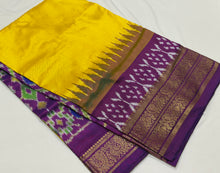 Arabhi- Gorgeous Yellow with Purple Handwoven Pure Double Ikat Silk with beautifully woven body with temples and ikat style woven kanchi borders rich pallu and contrast woven blouse