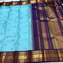 Vaibhogam- Gorgeous Powder Blue with Deep Blue Handwoven Pure Jari Korvai Kanjivaram Silk with gorgeous pattu buttas woven body rich meenakari silk thread and zari woven beautiful borders rich pallu with very intricate and contrast woven beautiful blouse