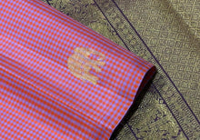 Saranga- Fantastic Borderless Handwoven Pure Jari Kanjivaram Silk in a beautiful pink and blue muted checked body with elephants motifs woven all over the body with rich deep brown pallu and contrast woven blouse
