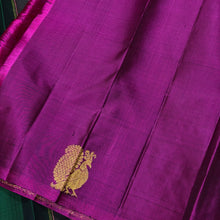 Saranga- Super Gorgeous Bottle Green with Deep Magenta Handwoven Pure Kanjivaram Silk woven in half and half style with muthukattam vertical stripes running vertically all over the body with peacocks woven body rich pallu and contrast woven blouse