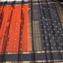 Sahana- Stunning Rust with Black Buttas Handwoven Pure Kanjivaram Silk with beautiful buttas woven body with doublepet borders rich buttas woven pallu and contrast woven blouse