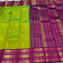 Vaibhogam- Mesmerising Parrot Green with Deep Magenta Handwoven Pure Jari Korvai Buttas Woven Kanjivaram Silk with beautiful varisaipet borders gorgeous pallu and contrast woven blouse