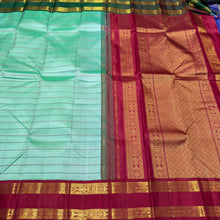 Vaibhogam- Gorgeous Pastel Green with Ganga Jamuna Bottle Green and Arakku Red borders with Neli Veldhari woven beautiful body with fishpet double borders rich pallu and contrast woven blouse